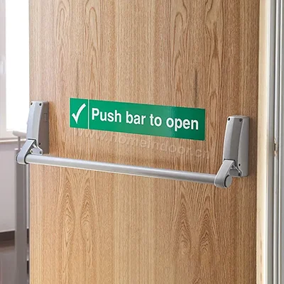 Grey steel panic push bar for emergency door