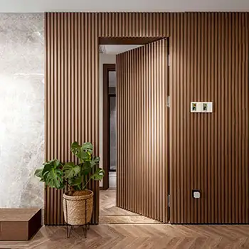 Modern wood fluted trimless hidden door