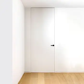 White wood flush trimless floor to ceiling interior closet door