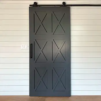 Interior black metal framed wood barn sliding door