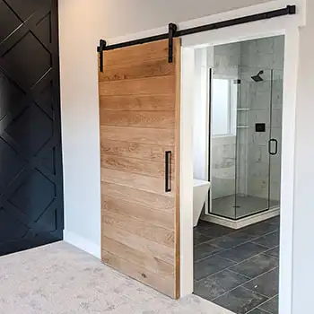 Solid wood tongue groove sliding barn door for master bathroom