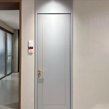 interior Grey flush wood door with golden metal inlay